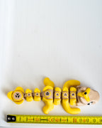 yellow articulated banana dragon 3d printed flexi dragon figure with ruler