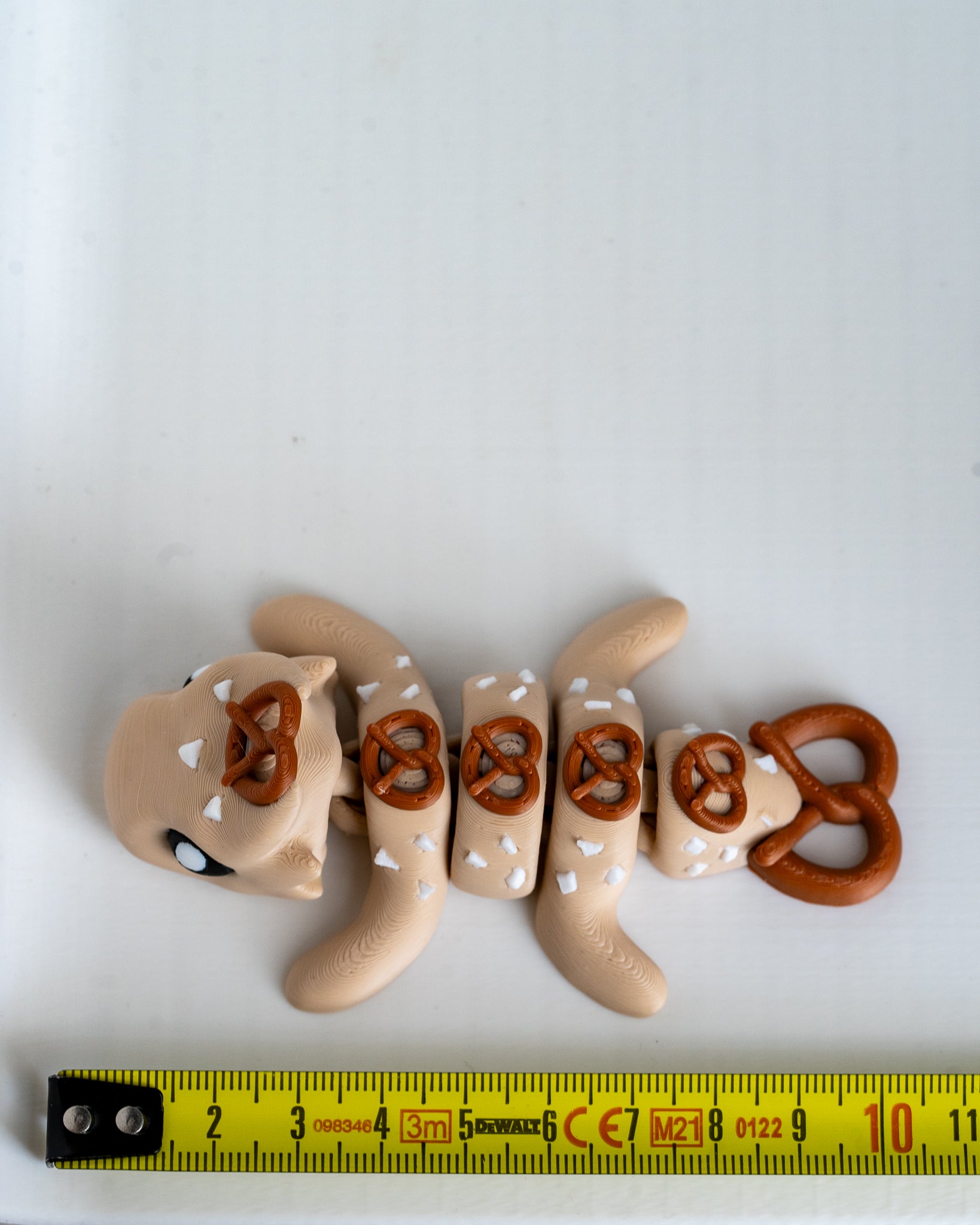 pretzel dragon figurine 3d printed articulated dragon with ruler