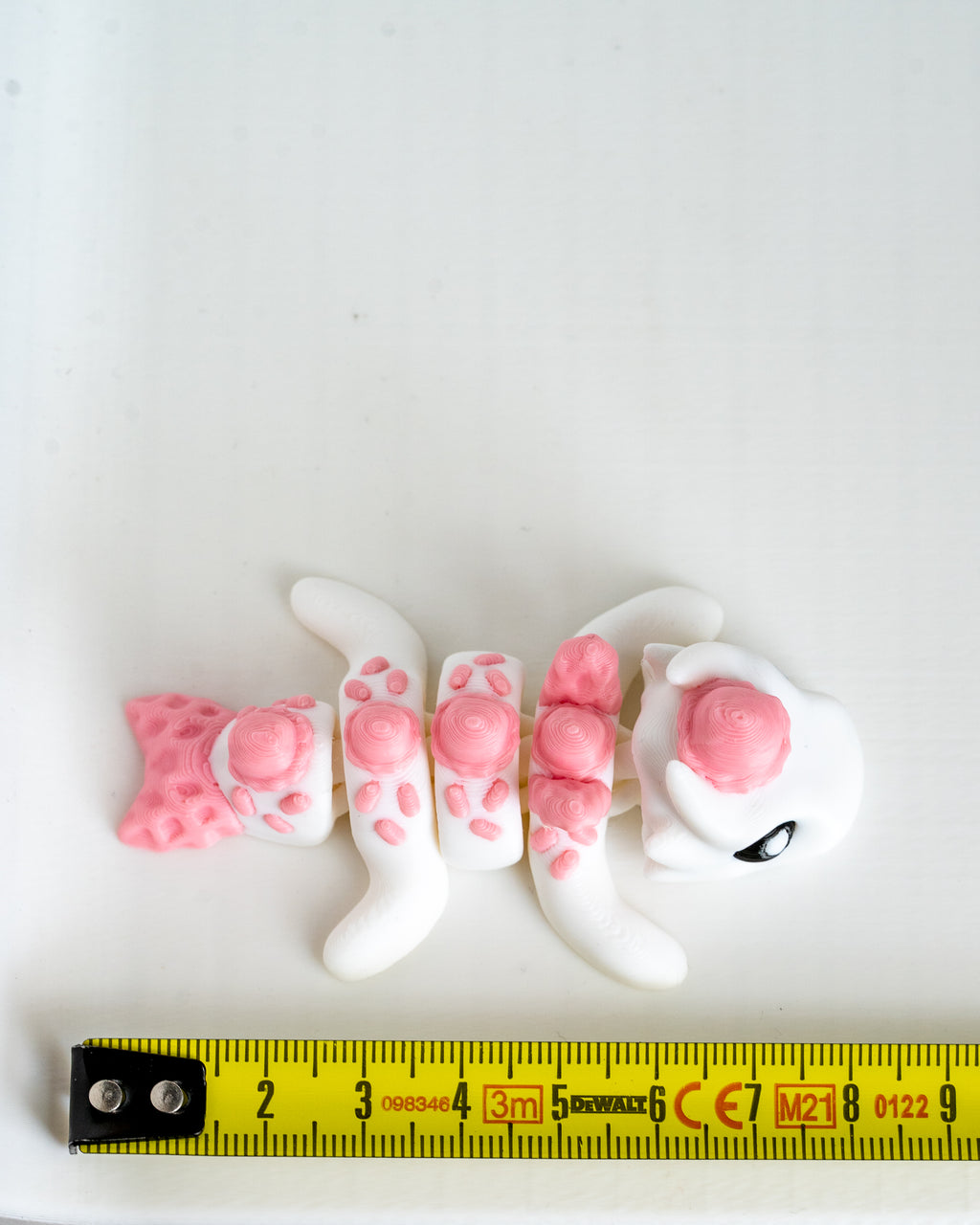 ice cream pink dragon figurine 3d printed articulated dragon with ruler