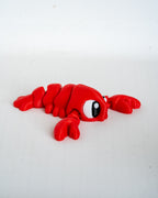 Mini lobster figure viewed from side