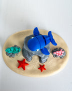 Blue whale figurine with underwater display stand