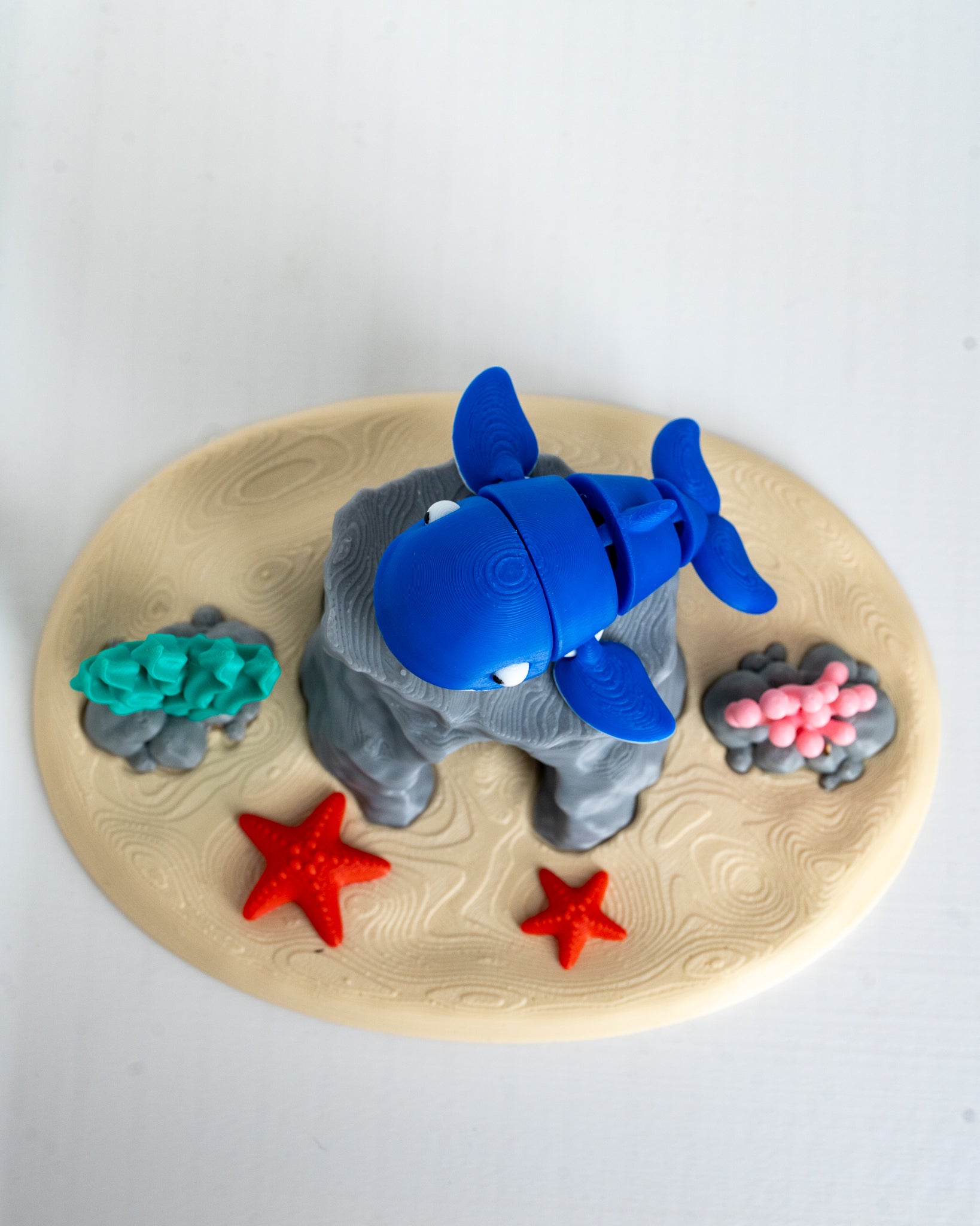 Blue whale figurine with underwater display stand