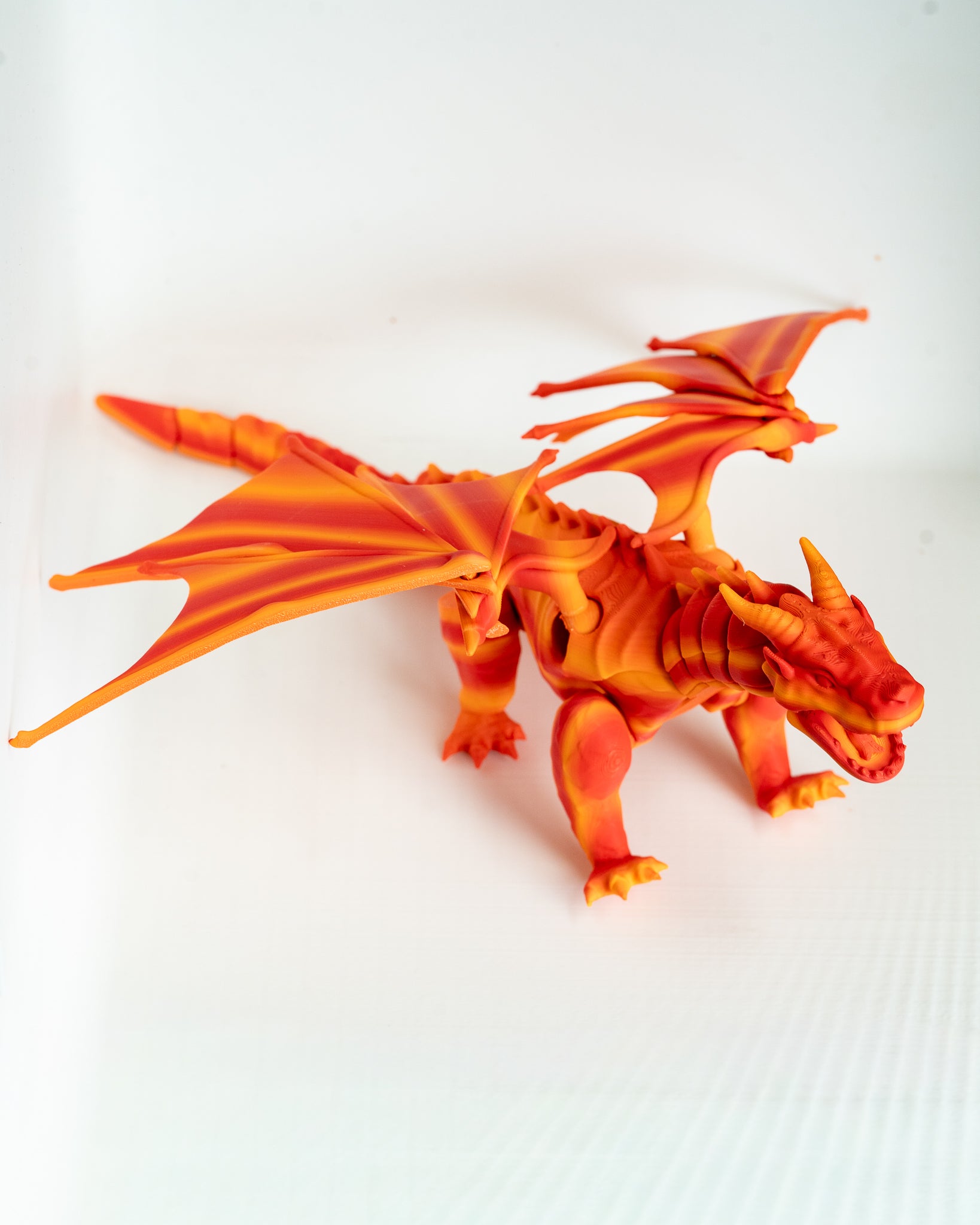 Orange winged dragon decorative figure