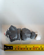 Cat figure next to measuring tape for scale
