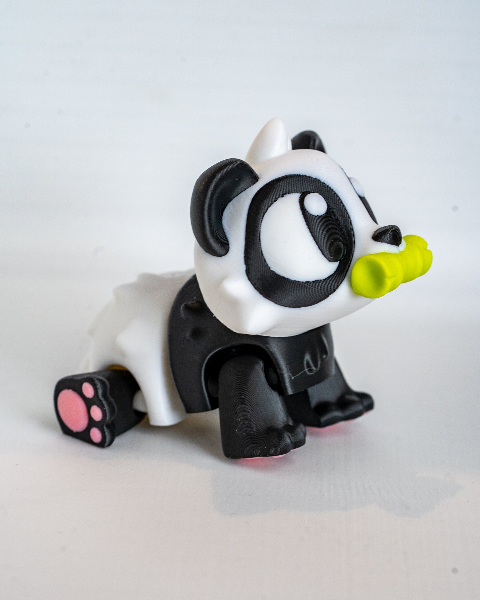 Mini panda figurine with bamboo