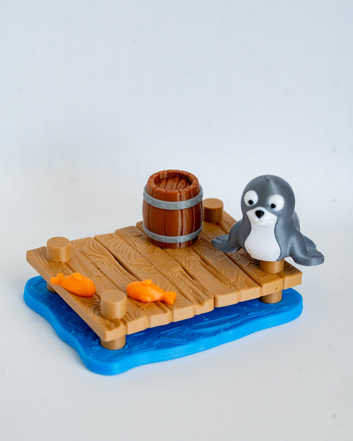 Seal figurine with wooden dock display