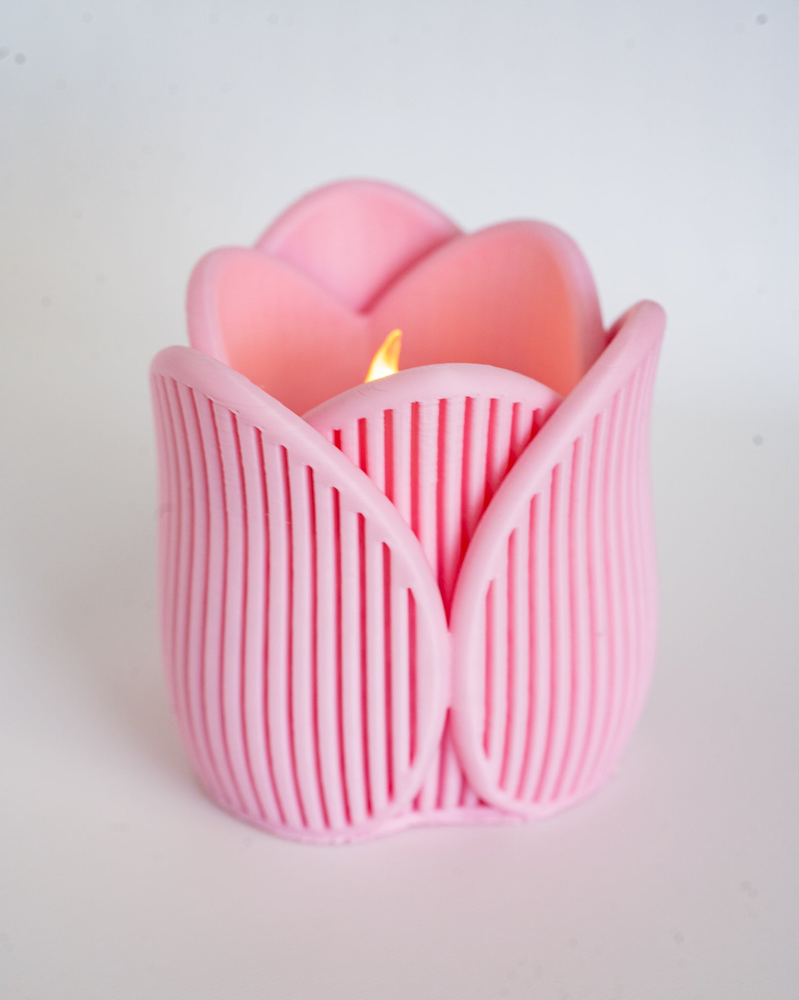 Pink tulip tealight holder viewed from side