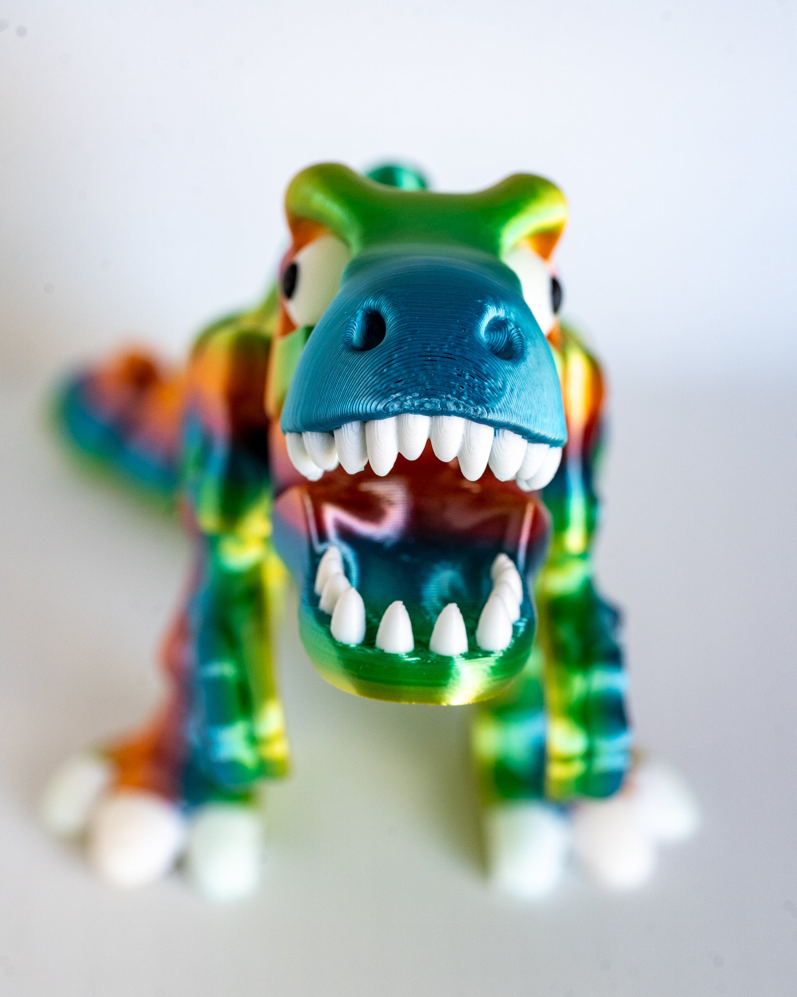 Colourful T-Rex skeleton figure in rainbow filament