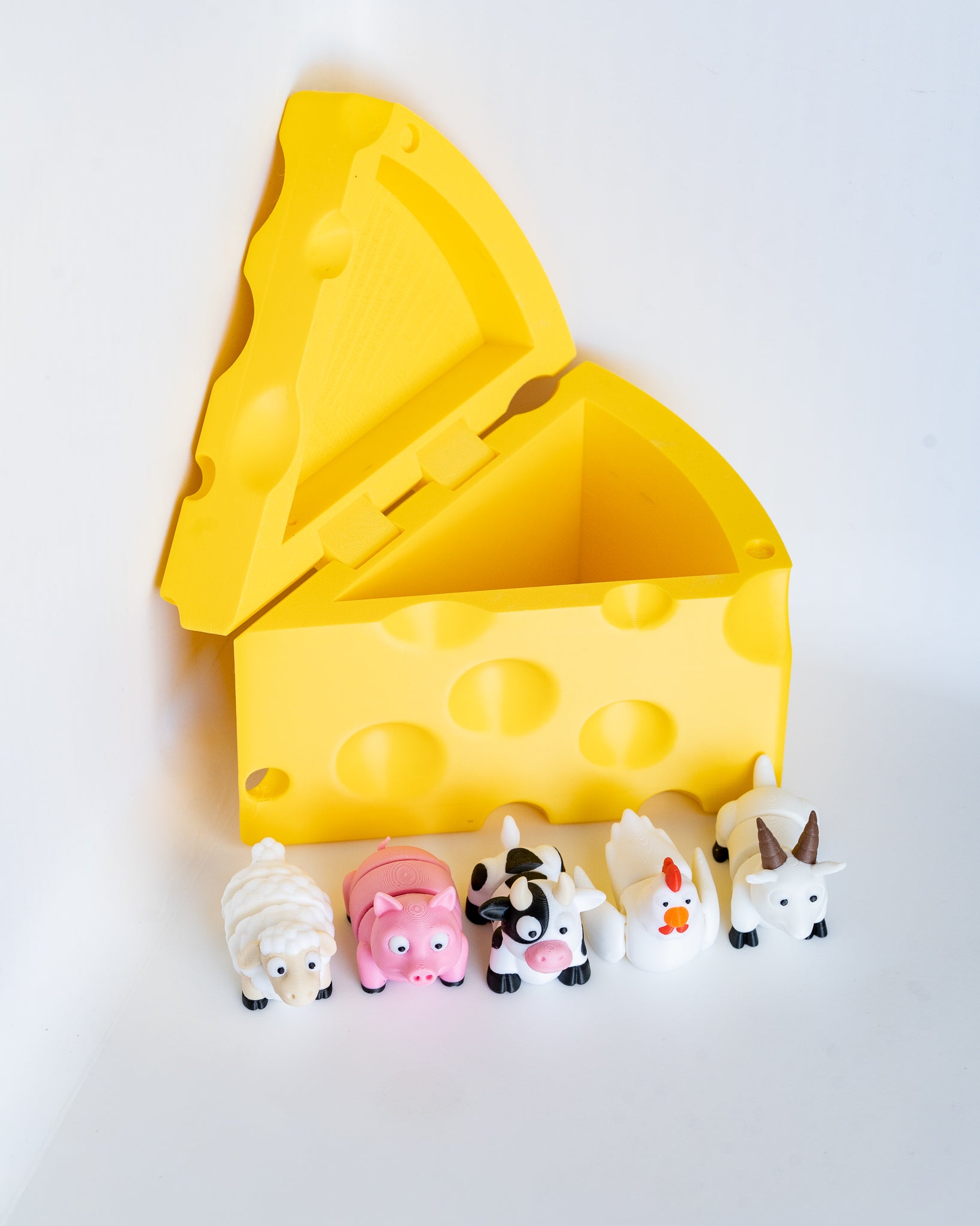 Farm animal figures with cheese shaped storage container
