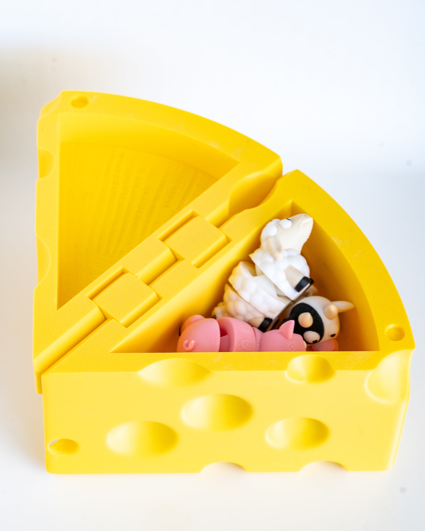 Cheese wedge box filled with mini farm animal figures