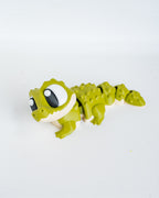 Articulated crocodile figurine with cartoon eyes