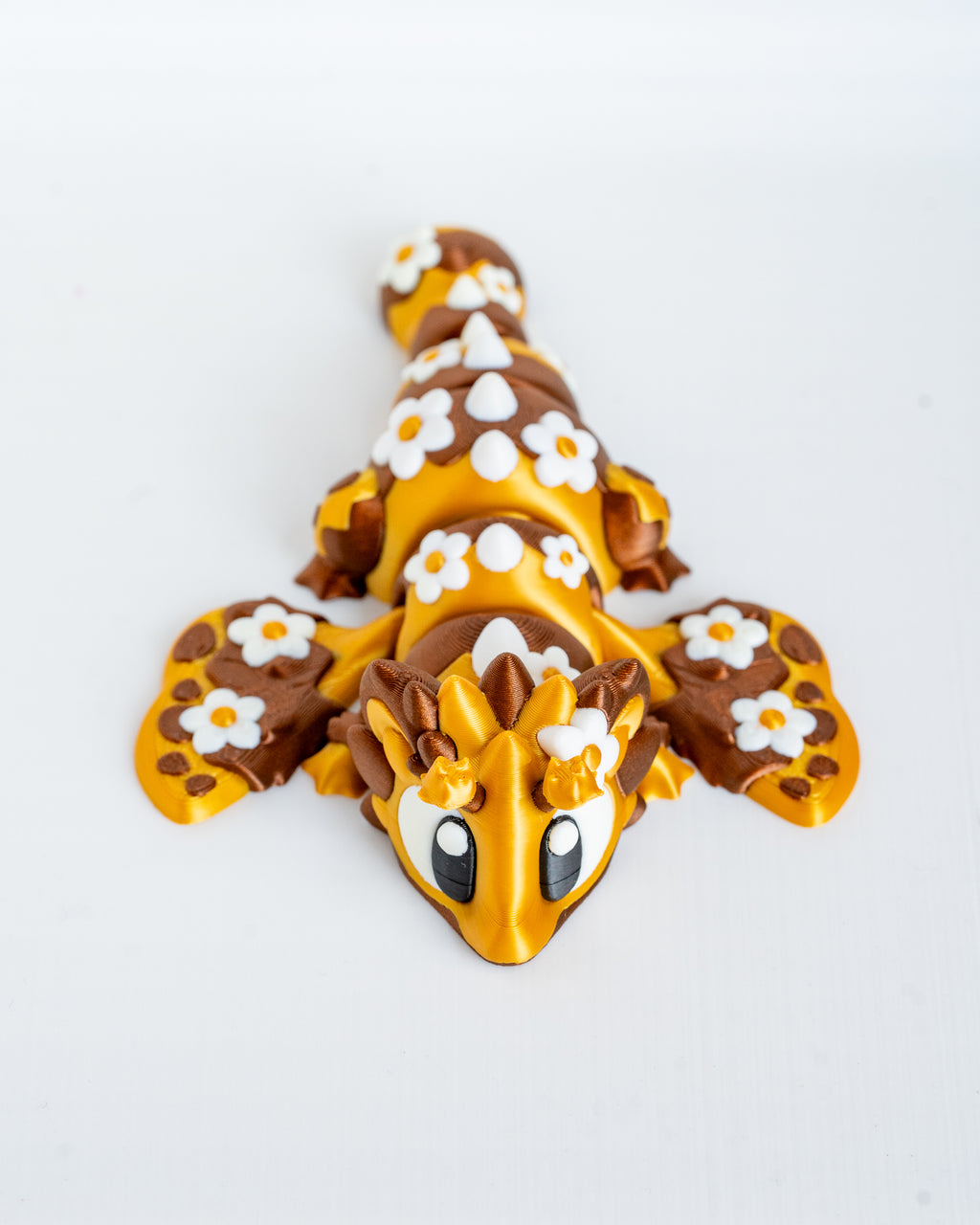 Articulated bee dragon figurine with floral details