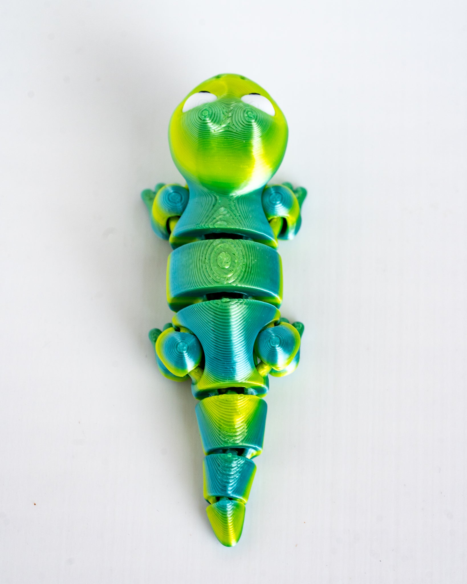 Top view of articulated lizard figure