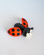 Ladybug figure with open wings