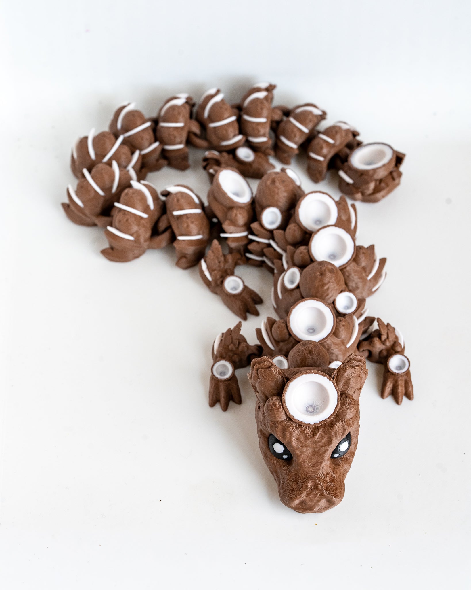Articulated coconut dragon figurine