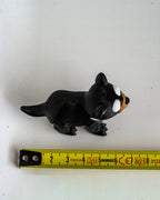 tasmanian devil decorative figure with a measuring tape for scale on a white background