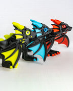 close up Trio of articulated neon dragons in Neon Green Sky Blue and Fire Red