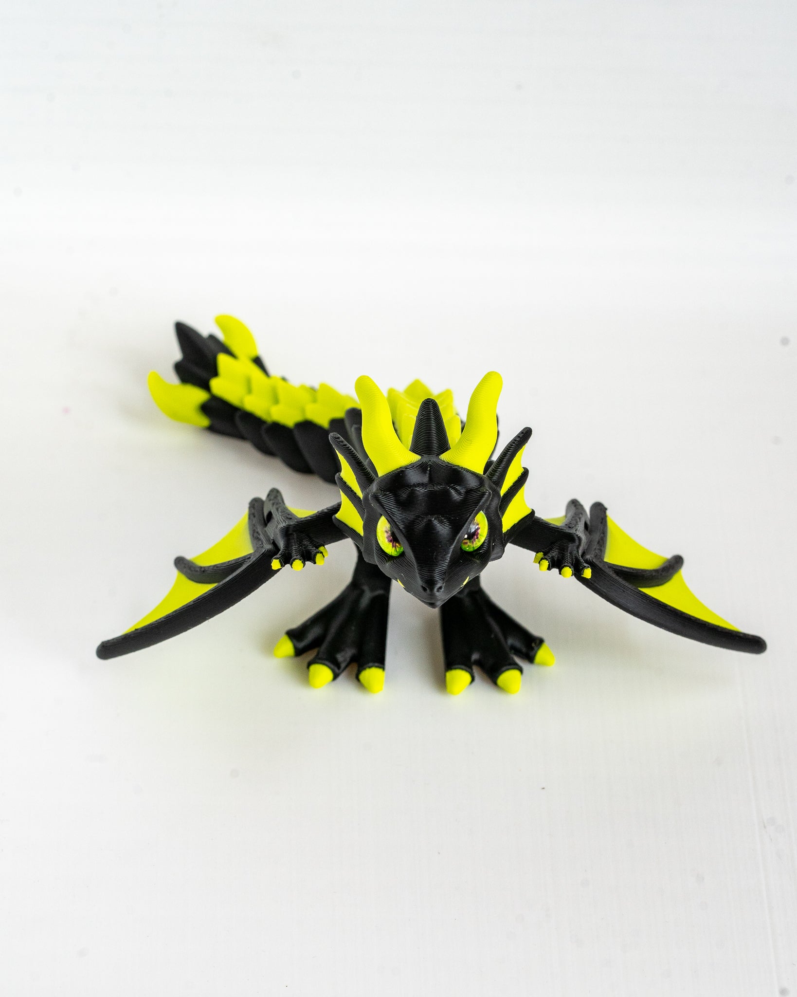 Articulated neon green dragon figurine