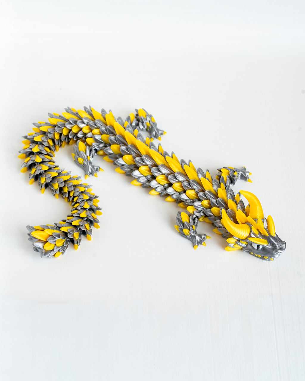 Yellow and silver dragon decorative figure