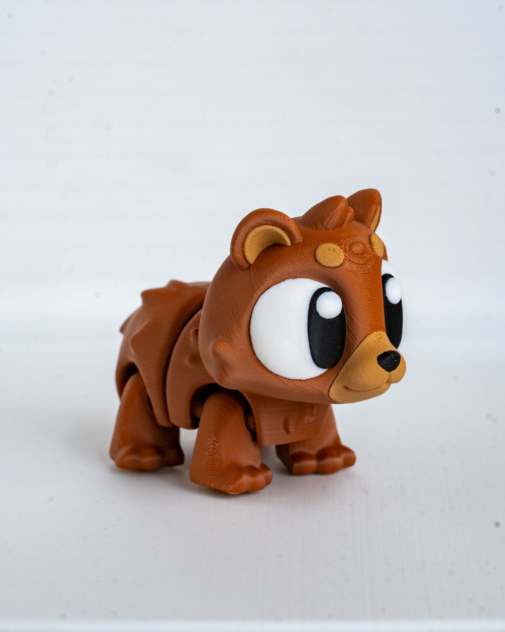 Mini bear figurine with cartoon eyes