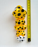 Gecko figure next to measuring tape for scale