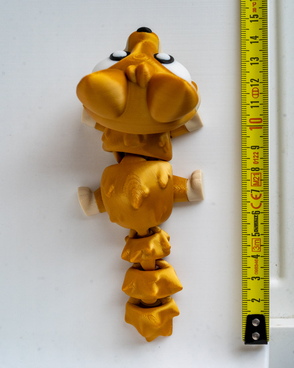 Fox figure next to measuring tape for scale