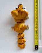 Fox figure next to measuring tape for scale