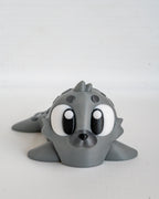 Articulated seal figurine with cartoon eyes