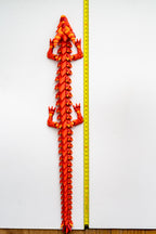 fire Dragon figure next to measuring tape for scale