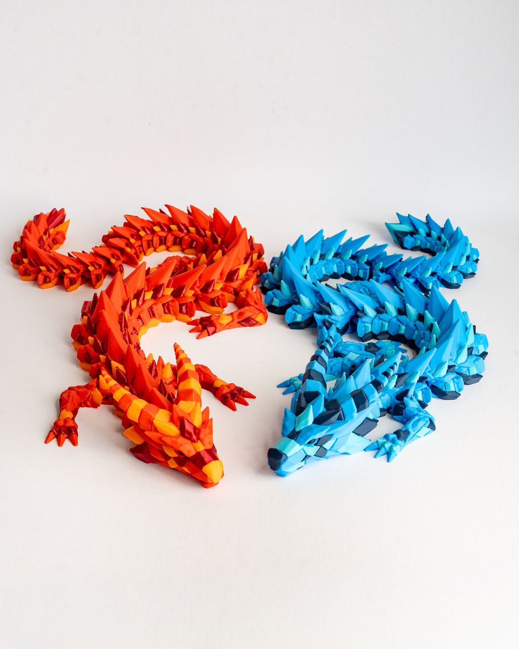 Articulated fire and ice dragon figurines