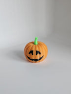 Small pumpkin decor figures in orange and green colours