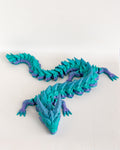 Blue and purple dragon on a white background