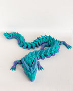 Blue and purple dragon on a white background