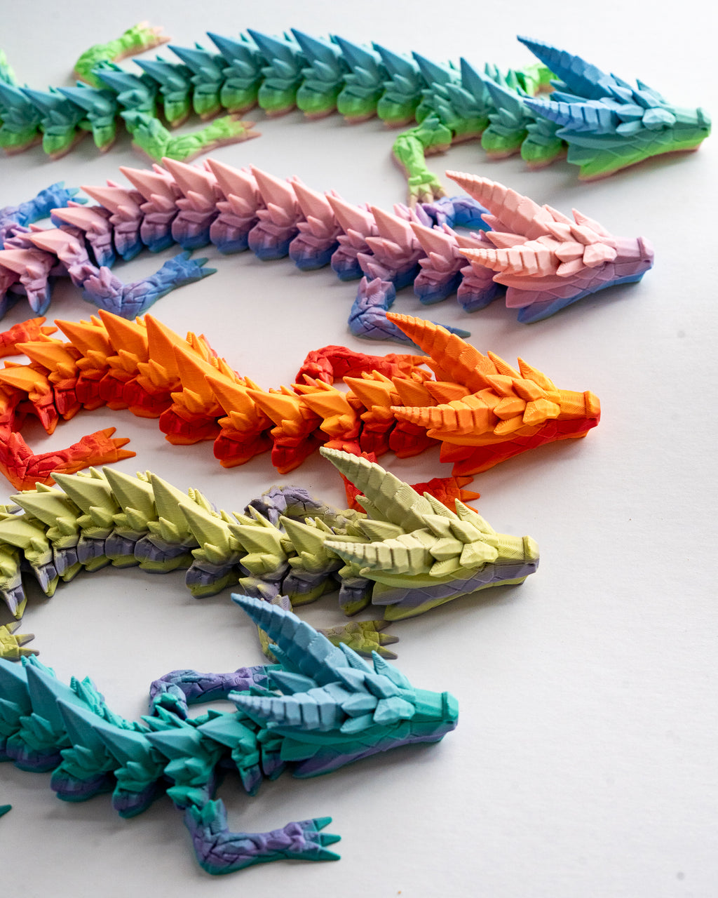 Articulated Prismor dragon figurines in multiple colour styles