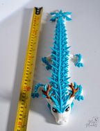Ice dragon figure next to measuring tape for scale