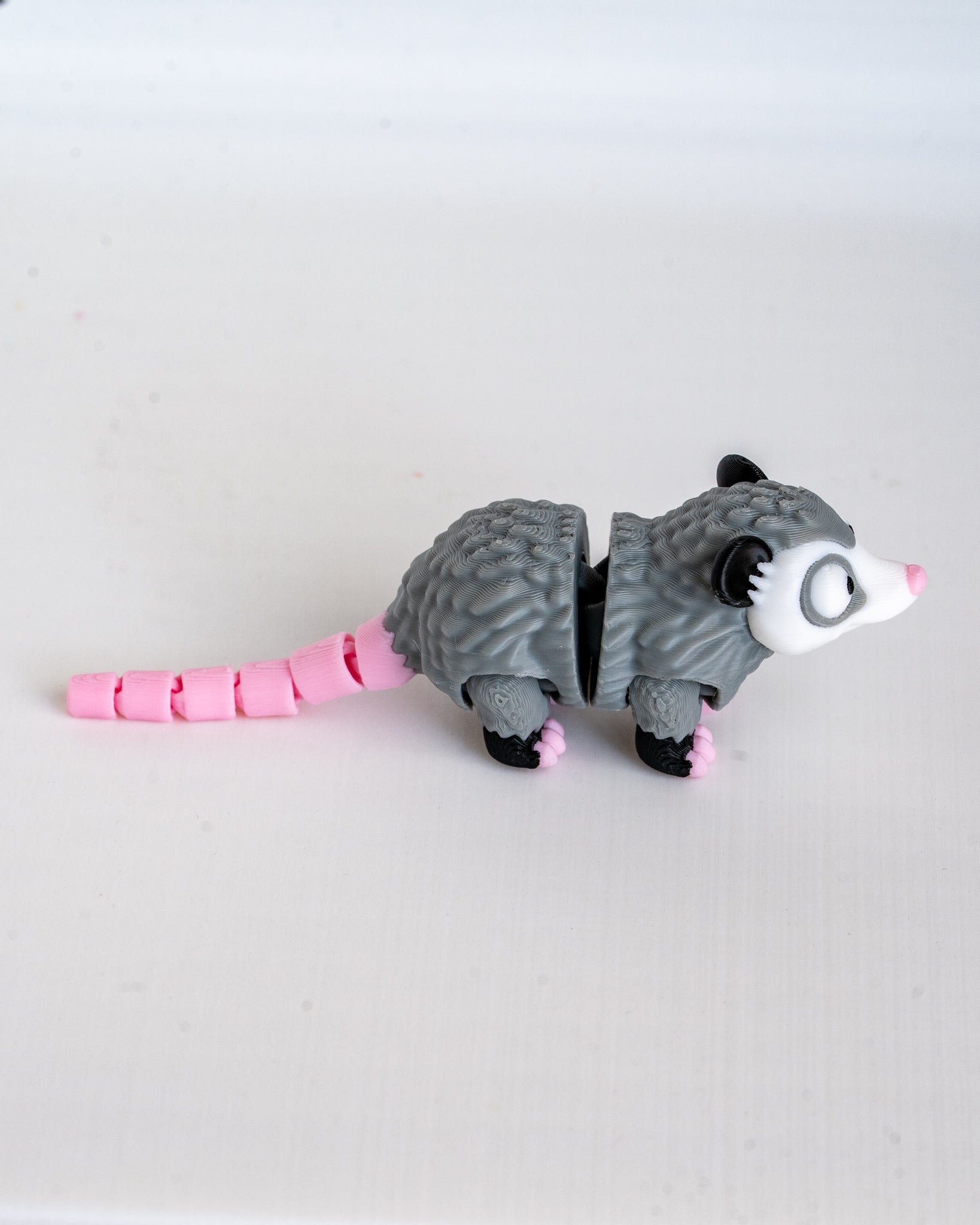 Possum figure viewed from side