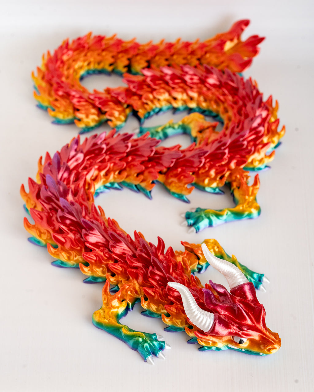Colorful dragon figure on a white background