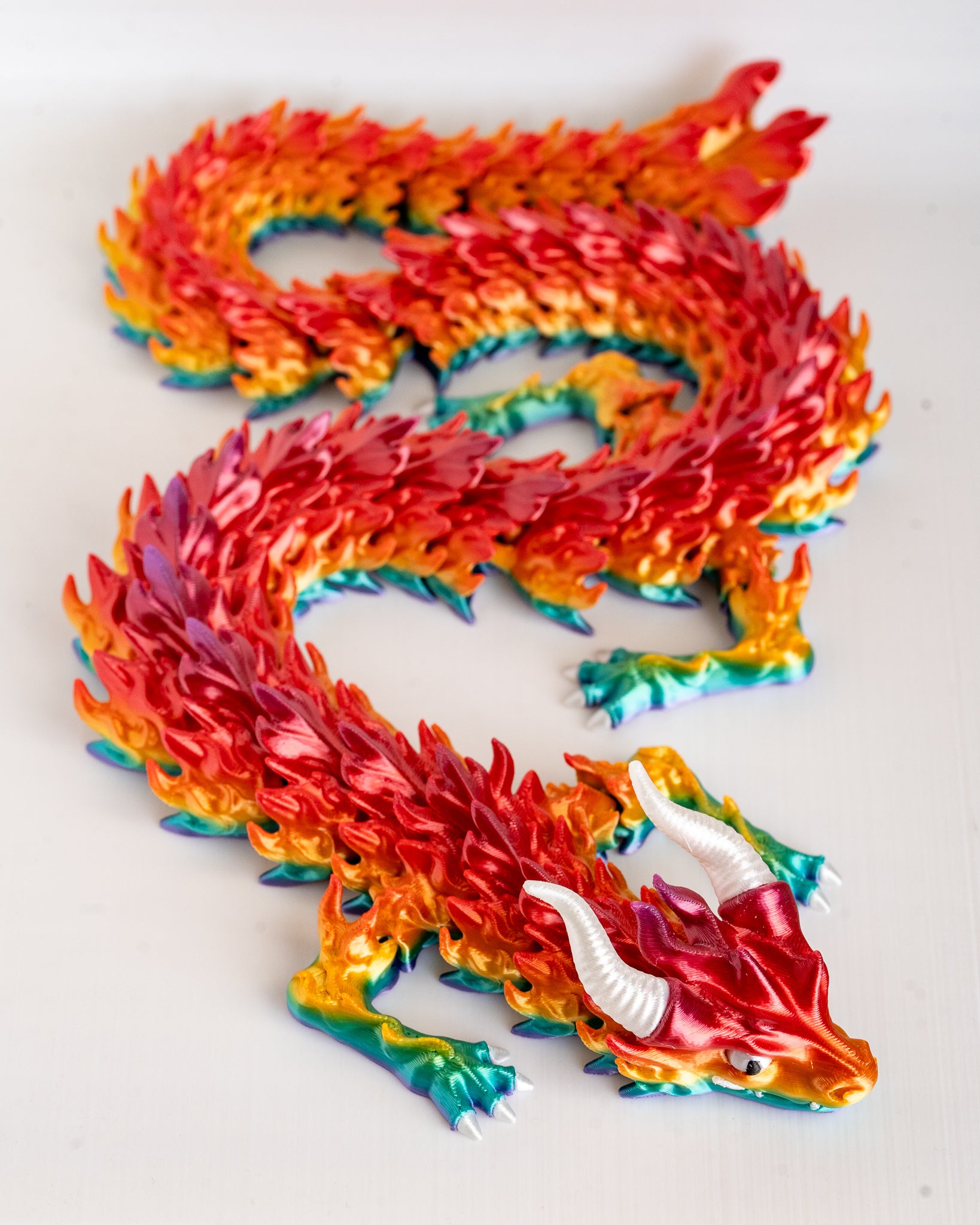 Colorful dragon figure on a white background