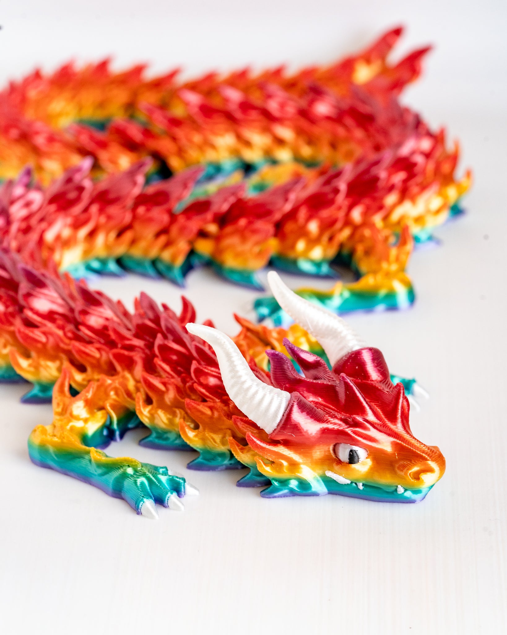 Colorful dragon figure on a white background