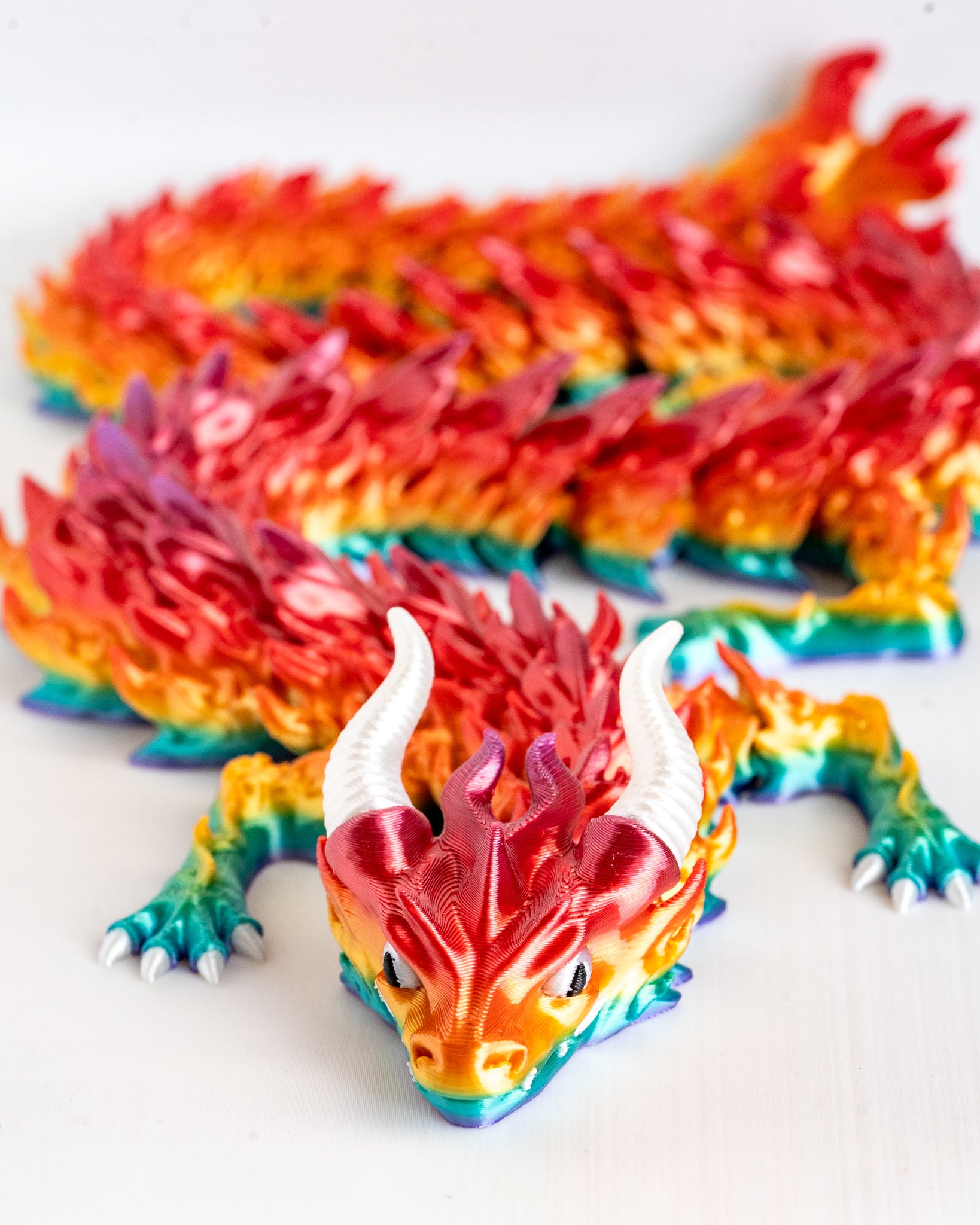 Colorful dragon figurine on a white background