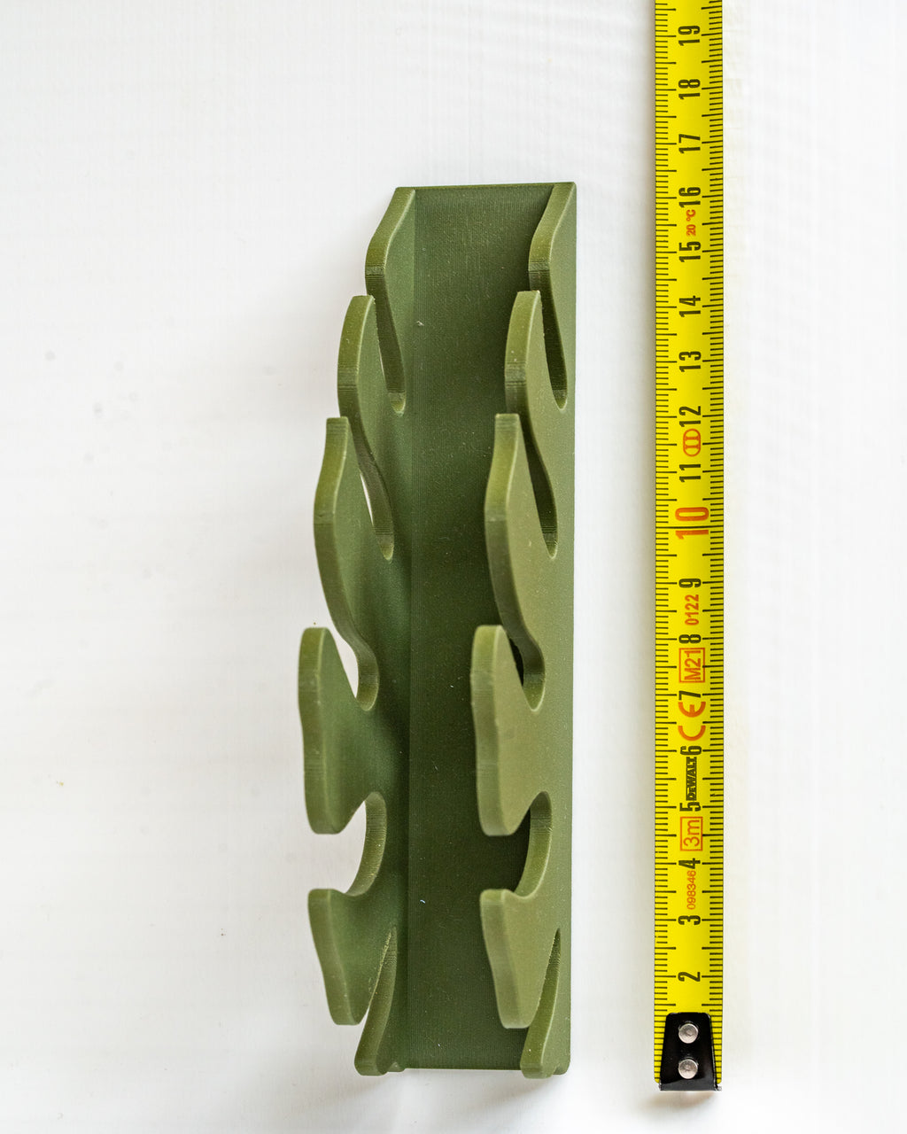 monstera napkin holder next to measuring tape for a scale