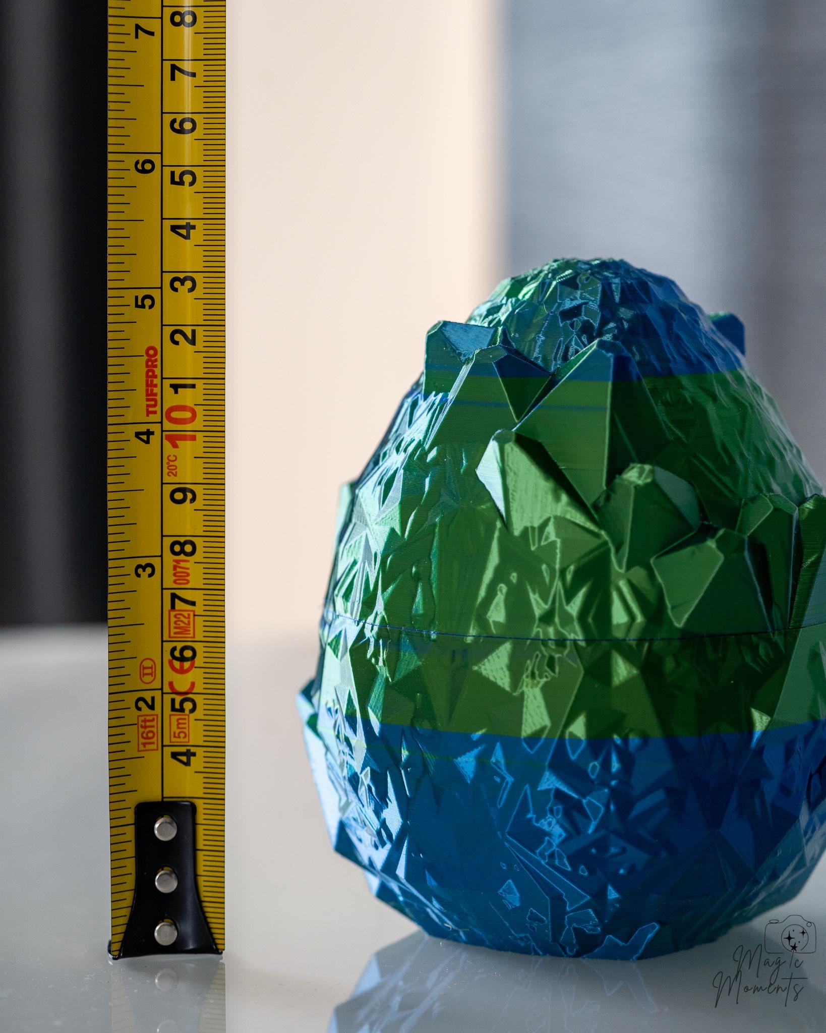 Dragon egg container next to measuring tape for scale