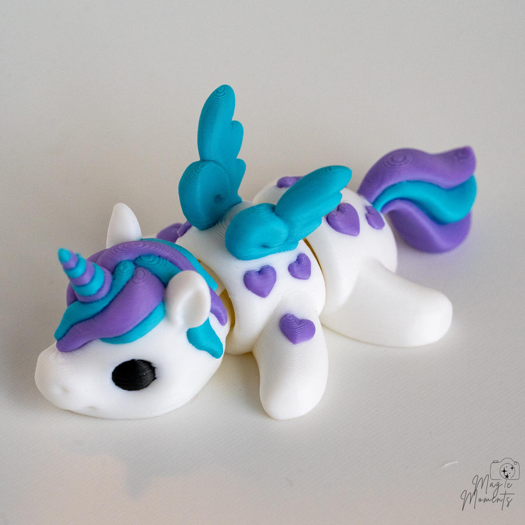 Pastel unicorn figure with colourful mane horn and tail details