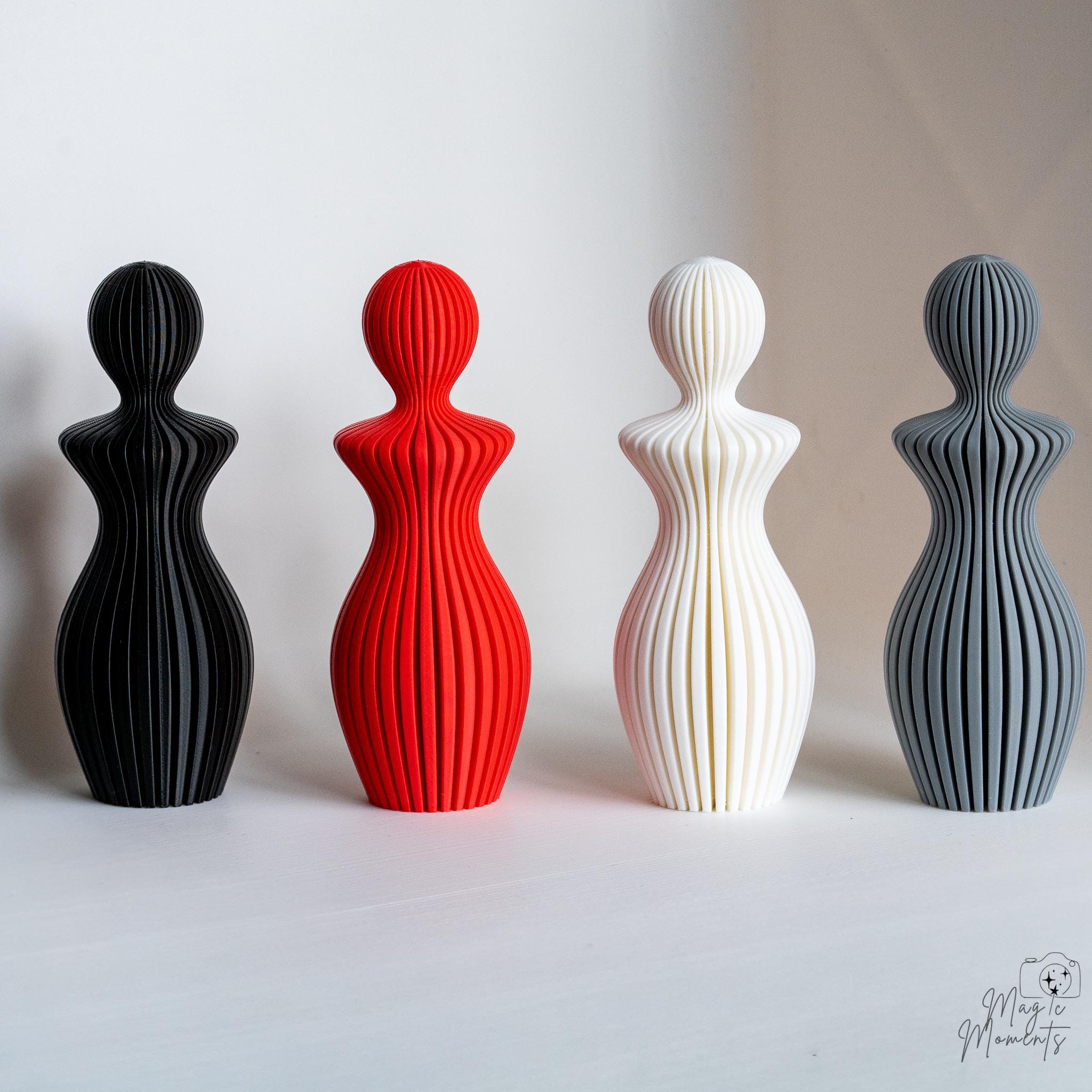 3D printed couple sculptures in red black white and grey colours