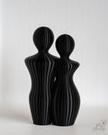 Black abstract couple sculpture with modern minimalist finish