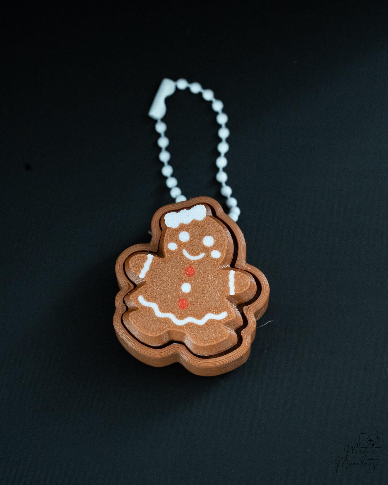 Gingerbread clicker with silver hanging loop and layered design