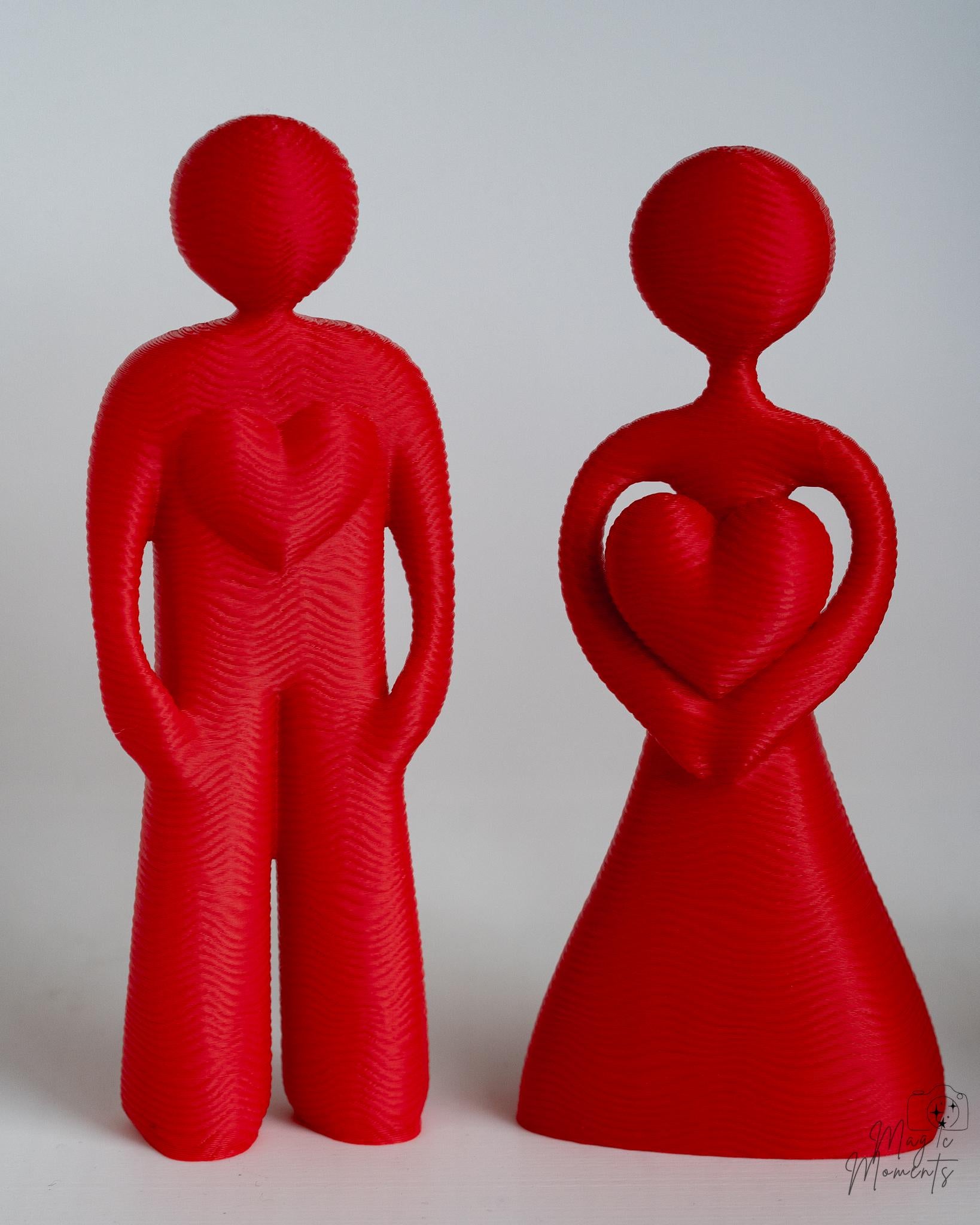 red couple decor sculpture