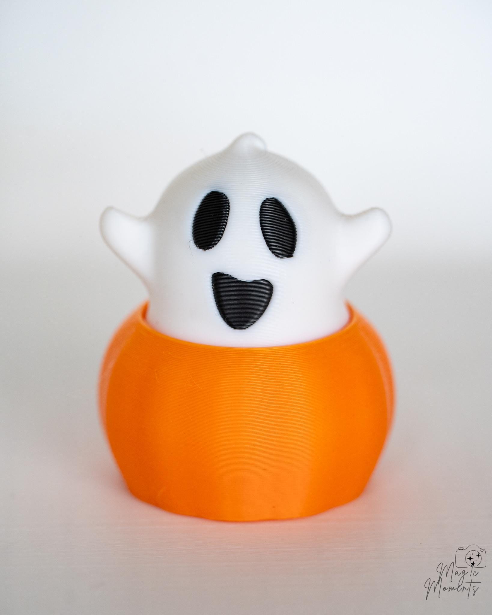 Ghost pumpkin clicker with surprised expression