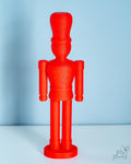Minimalist red nutcracker figure with fuzzy body design