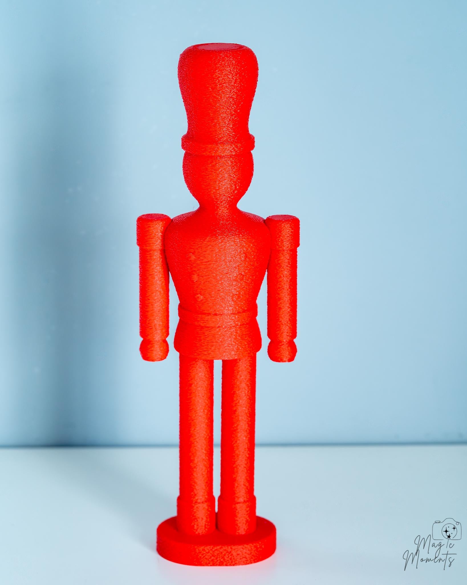 Minimalist red nutcracker figure with fuzzy body design